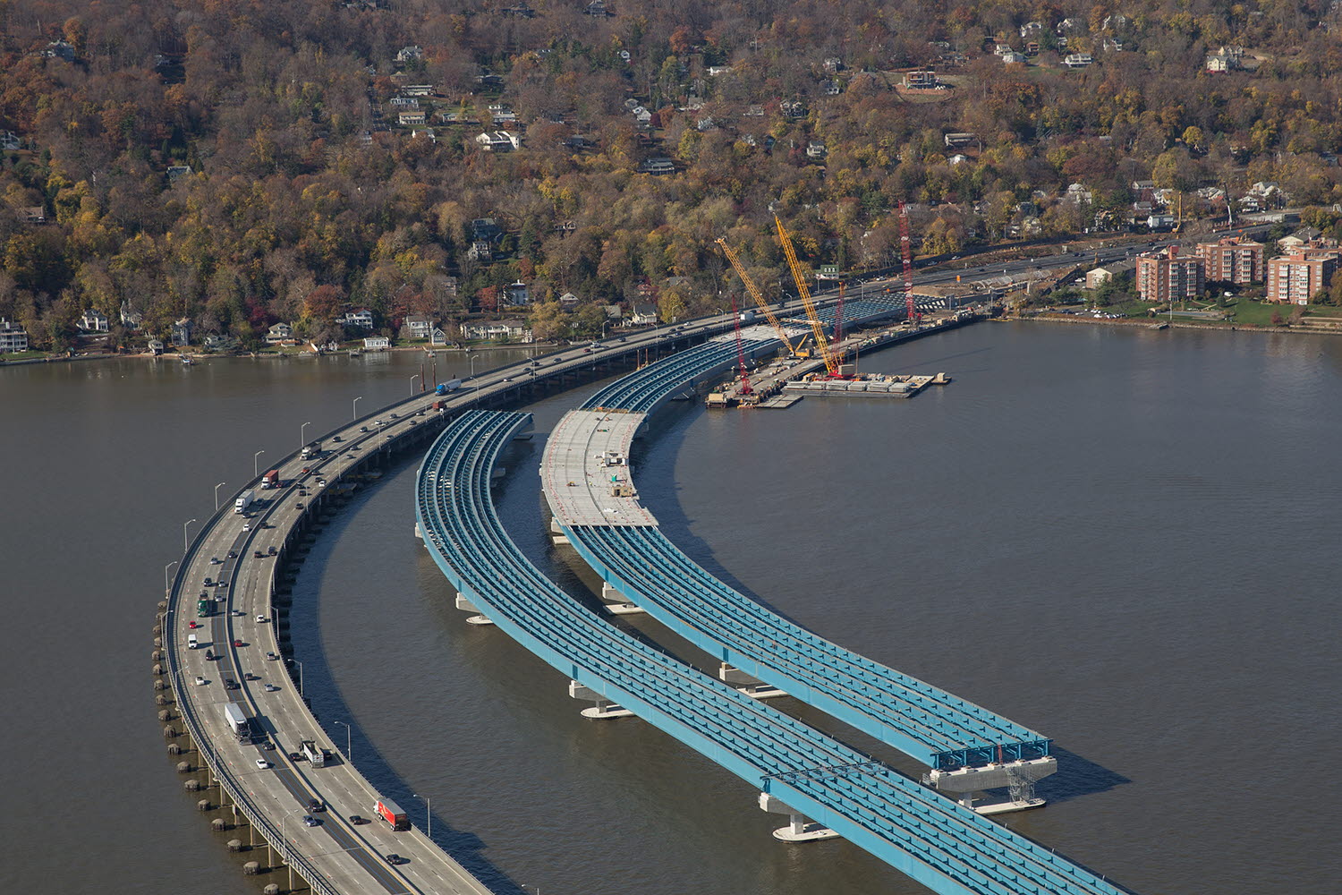 Aerial shot of the New NY Bridge under construction, clearly showing the trademark blue-color girders produced by High Steel Structures for the approach spans. The famous 